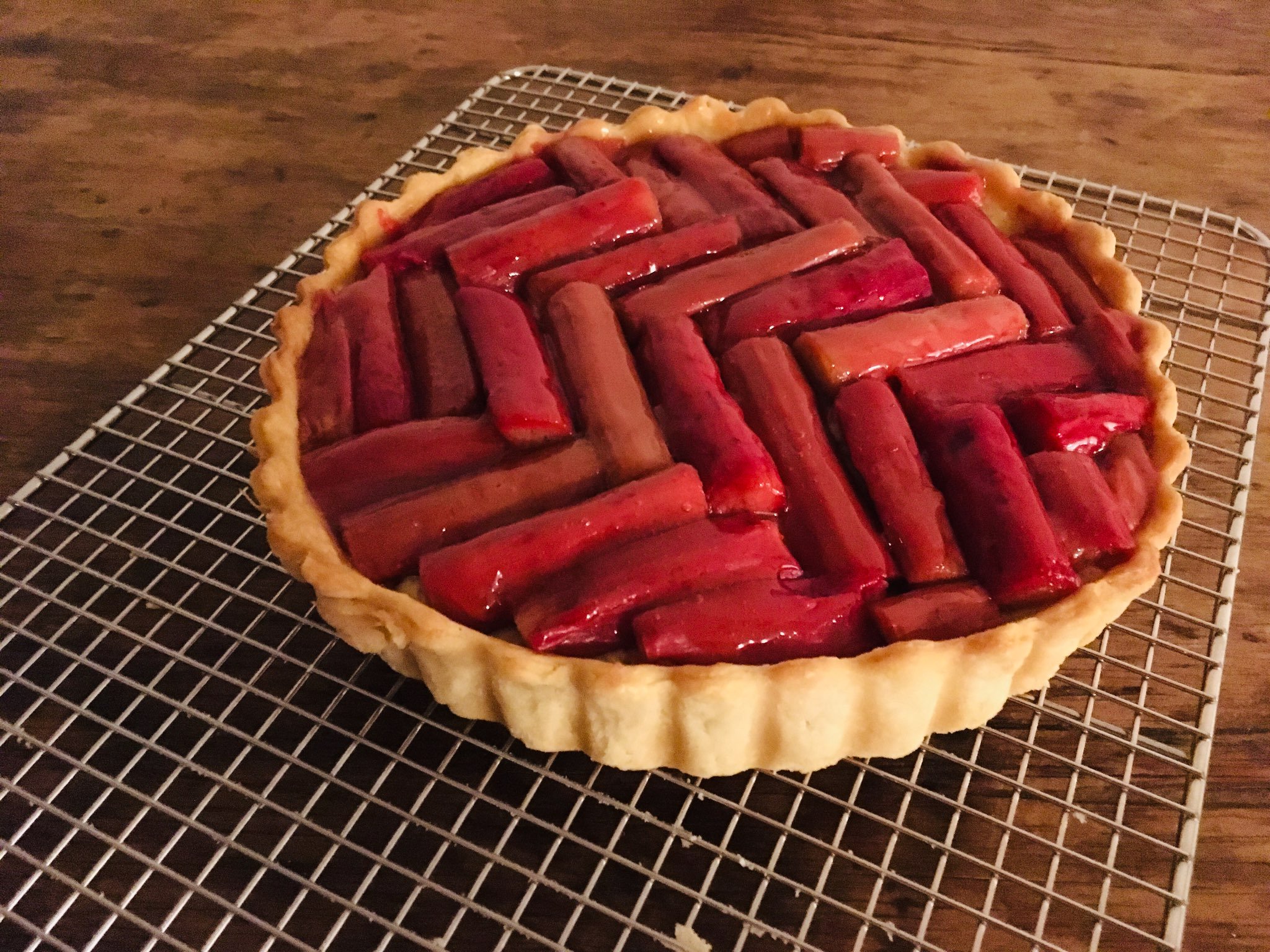 A truly beautiful tart with rods of cardamom arranched in chevron patterns all across the top.